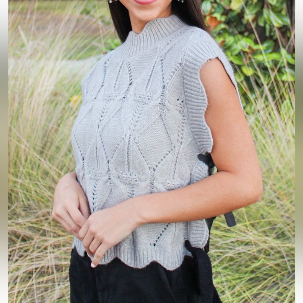 grey cable knit sweater with bow ties